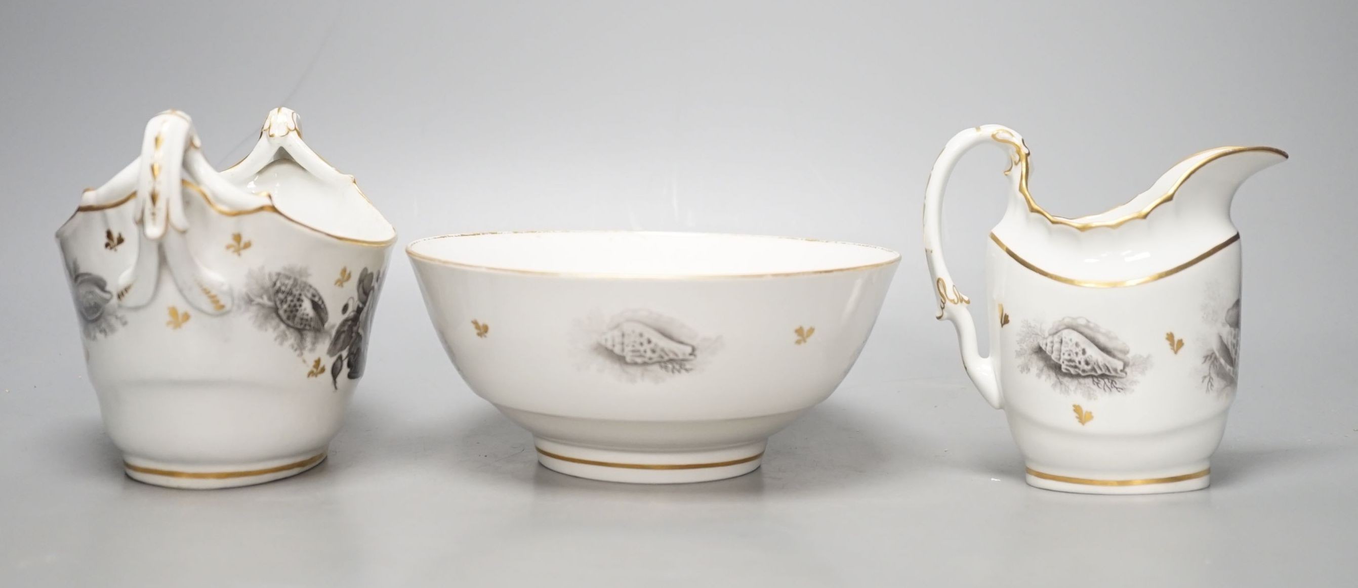 A Barr Flight and Barr cream jug bat printed with baskets of flowers and hell with additional gilded leaves, a matching boat shaped two handled sucrier and a bowl en suite , all with impressed marks. c. 1810